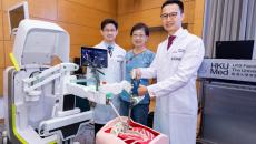 HKUMed doctors, together with their patient, demonstrate the robot-assisted technology for spine surgery 